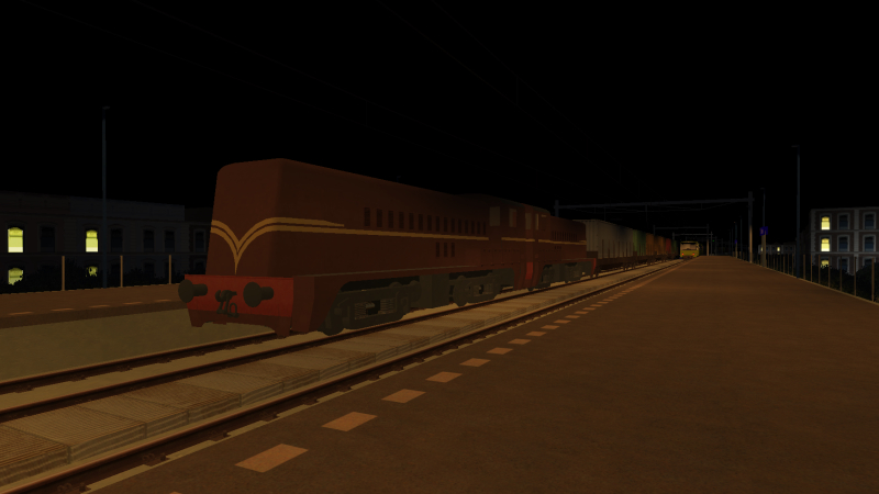 Shortly after, as the SG2 unit departs for Simvliet Centraal, a pair of NS 2200 locomotives with the southbound freight <br />rumbles through Delfsblaak.