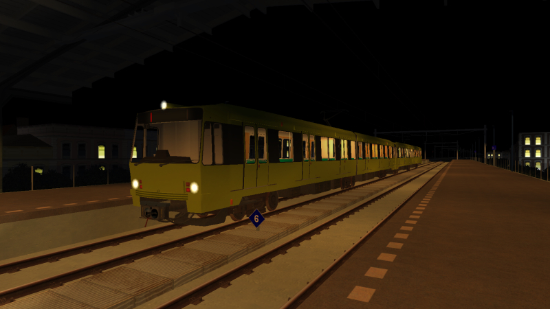 NS SG2 unit is about to stop at Delfsblaak on the evening of 18th December 2019 while forming the 22:00 Simvliet to <br />Essim train.