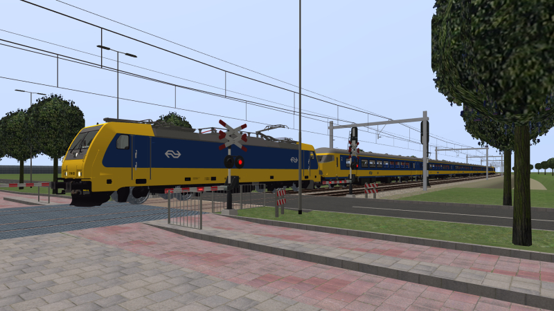 NS TRAXX hauls the Simvliet to Rijndam Intercity Direct train as it speeds through the level crossing at Delfsblaak <br />on 13th March 2020.