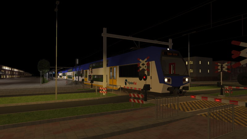 RijndamRail RR-DDM EMU departs Groenburg station on the evening of Wednesday 9th March 2022 as the train forms the 22:10 Zeeburg to Rijndam Central.