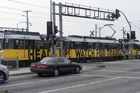 Blue Line at Vernon Ave crossing pulling into Vernon Station