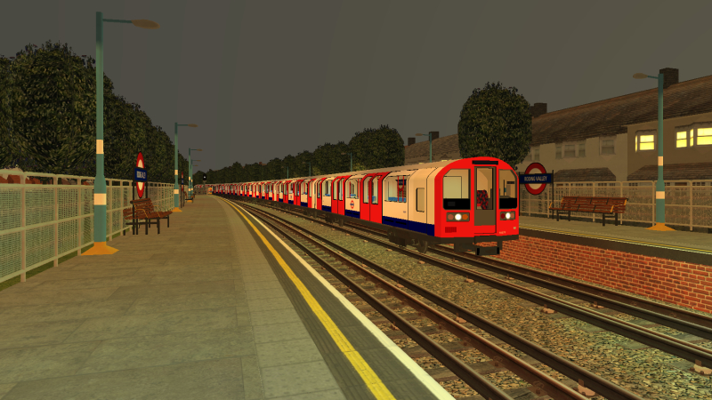 LU1992TS arrives at Roding Valley with Central Line train to Hainault on a weekday evening in March 2021.