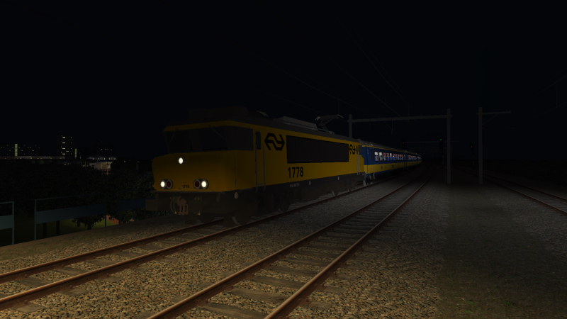 NS 1778 is on its last few minutes of its 21:00 Apeldoorn to Simvilet Centraal train as it is seen passing Simvilet Bergpark <br />on the evening of 10th July 2021.
