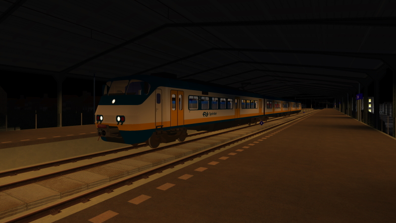 NS SGMm-III EMU arrives at Delfsblaak on the late evening of Sunday 20th November 2022 as the train forms the 22:30 Simvilet Centraal to Essim Zuid.